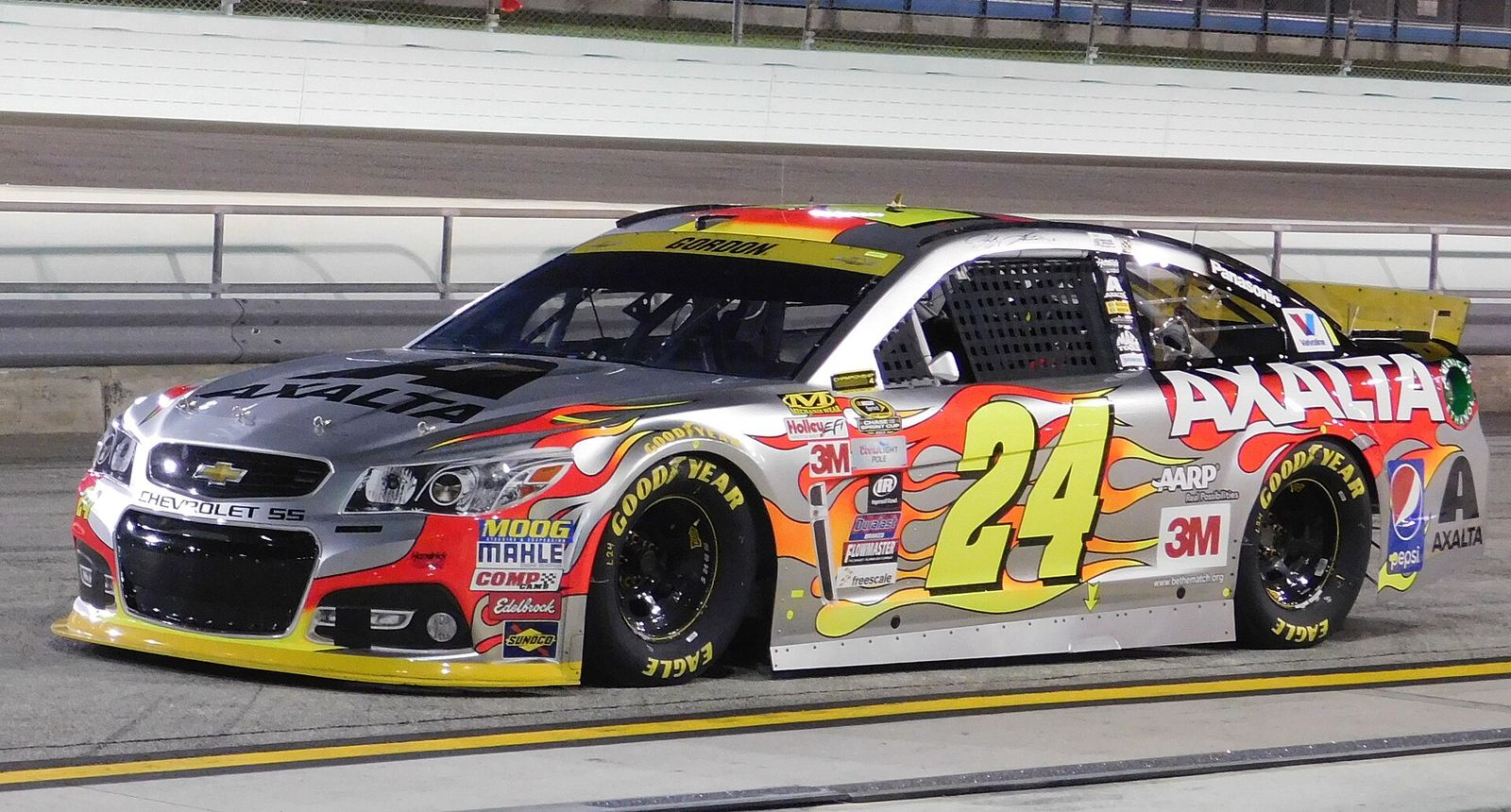 Jeff Gordon's silver No. 24 Axalta Chevrolet with flames on pit road at Homestead