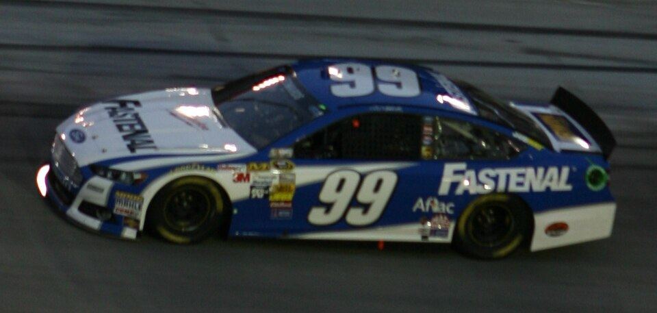 Carl Edwards's No. 99 Fastenal Ford racing under the lights at Bristol